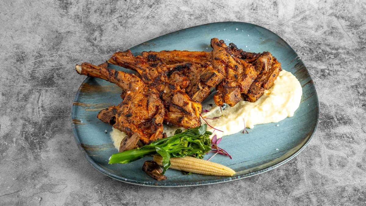 Prime Fire lamb cutlets with mashed potato and vegetables